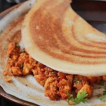 Paneer dosa filled with spiced cottage cheese