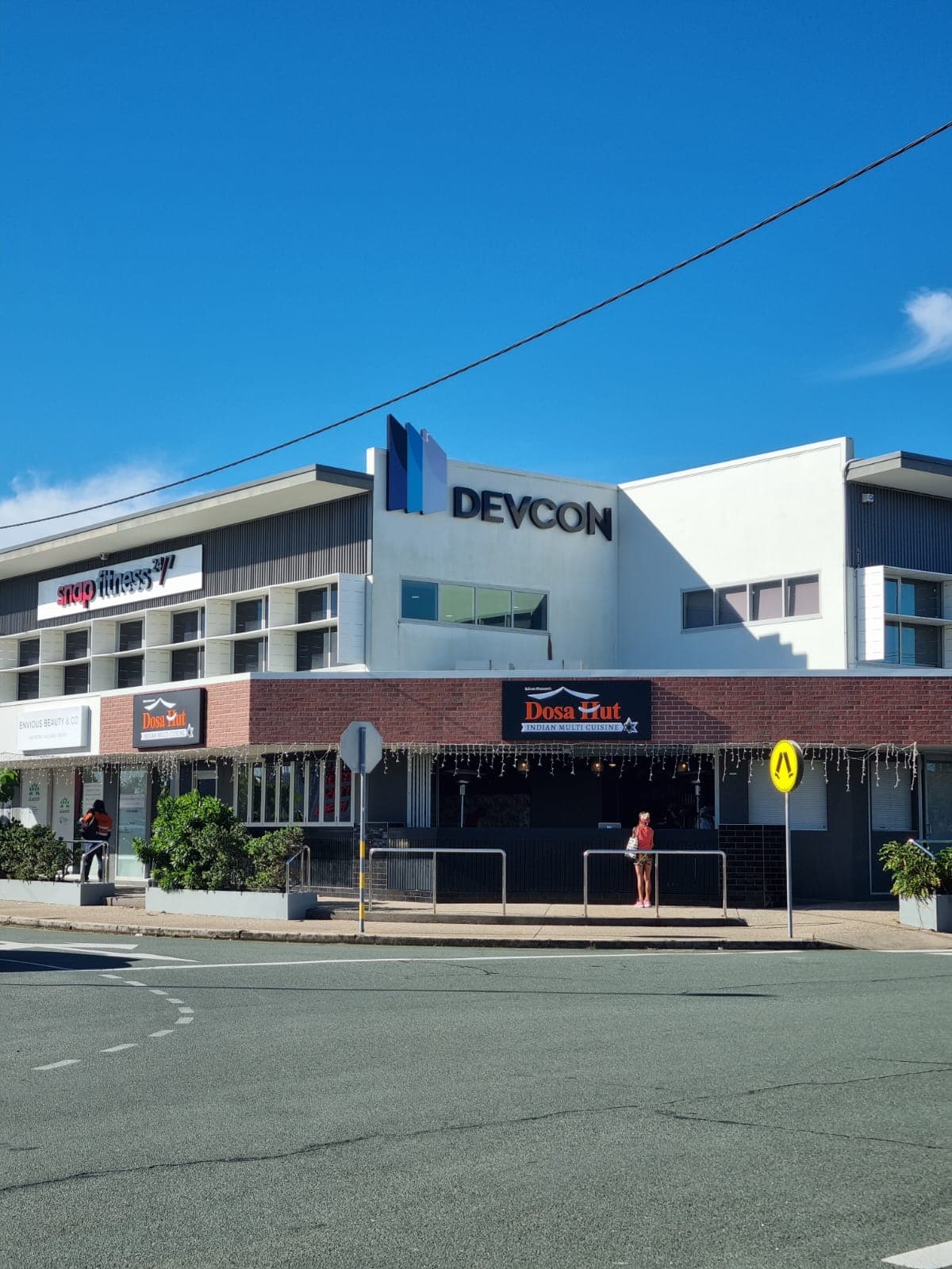 The Dosa Hut Sunshine Coast shopfront on Lutana Street, its sign above the awning, seen from across the road